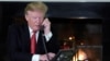 FILE - U.S. President Donald Trump conducts a phone call at the White House, in Washington, Dec. 24, 2018.