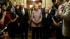 Democratic U.S. presidential candidate Hillary Clinton walks with Senate Minority Leader Harry Reid (D-Nev.) (L), Senator Chuck Schumer (D-N.Y.) (3rd R), Senator Patty Murray (D-Wash.) (2nd R) and Senator Dick Durbin (D-Ill.) (R) as she arrives to meet with Senate Democrats during their luncheon gathering at the U.S. Capitol in Washington, July 14, 2016.
