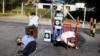 FILE - Mannequins depicting torture victims are left by demonstrators protesting against former Salvadoran army General Jose Guillermo Garcia prior to Garcia's arrival, at El Salvador International Airport in San Luis Talpa, Jan. 8, 2016. 