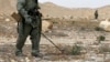 Russian serviceman checks for mines in Palmyra, Syria, in this photo provided by Russian Defense Ministry press service, April 8, 2016.