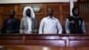 (L-R) Terror suspects Osman Abdi Dagane, Sahal Diriye, Hassan Aden Hassan and Mohamed Ali Abdikar, stand in the dock in Nairobi, Jan. 29, 2019, charged with carrying out a terrorist attack at Garissa University College four years ago. 