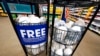 A display of free N95 respirator masks, provided by the US Department of Health and Human Services, sits outside the pharmacy at this Jackson, Miss., Kroger grocery store Feb. 2, 2022. 