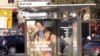 A billboard in Paris of a multi-ethnic family. French businesses are beginning to catch up to the reality on the streets. (L. Bryant/VOA)