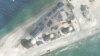 FILE - Construction is shown on Fiery Cross Reef, in the Spratly Islands, the disputed South China Sea in this March 9, 2017, satellite image released by CSIS Asia Maritime Transparency Initiative at the Center for Strategic and International Studies (CSIS).
