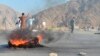 Men shout slogans against terrorists after a suicide attack among the protesters in Momandara district of Nangarhar province, Afghanistan, Sept. 11, 2018. 