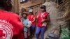 Red Cross volunteers talk to villagers about the plague outbreak, 30 miles west of Antananarivo, Madagascar, Oct. 16, 2017. 