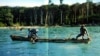 In this undated photo released by the Anthropological Survey of India, Sentinelese tribe men row their canoe in India's Andaman and Nicobar archipelago.