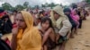 Rohingya Muslims, who recently crossed over from Myanmar into Bangladesh, wait for their turn to receive food aid near Balukhali refugee camp, Bangladesh, Friday, Sept. 15, 2017. Thousands of Rohingya are continuing to stream across the border, with U.N. officials and others demanding that Myanmar halt what they describe as a campaign of ethnic cleansing that has driven nearly 400,000 Rohingya to flee in the past three weeks.