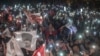Supporters of Istanbul Mayor Ekrem Imamoglu wave flags as they take part in a protest against the re-run of the Istanbul mayoral election in Istanbul, May 6, 2019. 