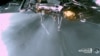The landing strut of the Odysseus lunar lander absorbs first contact with the lunar surface during its landing on the moon, as the liquid methane and liquid oxygen engine continues to throttle, Feb. 22, 2024. (Intuitive Machines via Reuters)