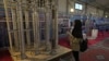 FILE - A student looks at Iran's domestically built centrifuges in an exhibition of the country's nuclear achievements, in Tehran, Feb. 8, 2023. The U.S. on March 7, 2024, threatened to take action through the IAEA if Iran is not more forthcoming about its nuclear activity.