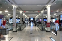 People shop at Macy's Herald Square store on the first day of the phase two re-opening of businesses following the outbreak of the coronavirus disease (COVID-19), in the Manhattan borough of New York City, June 22, 2020.
