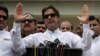 Cricket star-turned-politician Imran Khan, chairman of Pakistan Tehreek-e-Insaf (PTI), speaks to members of media after casting his vote at a polling station during the general election in Islamabad, Pakistan, July 25, 2018. On Friday he was declared the winner of the parliamentary election.