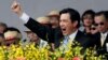 Taiwan's President Ma Ying-jeou cheers with the audience during National Day celebrations in front of the Presidential Office in Taipei, Taiwan, Oct. 10, 2013.