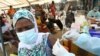 A resident receives a vaccine as the campaign against Ebola continues in Alakro, the slum where the first case of Ebola was confirmed, in Abidjan, Ivory Coast, August 17, 2021. 