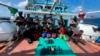 This photograph provided by the Indian Navy shows armed naval commandos standing behind 10 captured Somali pirates with their hands tied behind after they thwarted a piracy attempt on the Iranian-flagged fishing vessel Al Naeemi off the east coast of Somalia, Jan.29, 2024.
