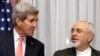 U.S. Secretary of State John Kerry, left, and Iran's Foreign Minister Mohammad Javad Zarif are seen before resuming talks over Iran's nuclear programme in Lausanne, Switzerland, March 16, 2015. 