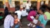 Women wait to have a malaria vaccine administered to their children at the comprehensive Health Centre in Agudama-Epie, in Yenagoa, Nigeria, Dec. 9, 2024.