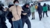 Police officers detain a demonstrator protesting the court verdict against a leading rights activist in the city of Ufa in the Republic of Bashkortostan, Russia, in this still image from video, Jan. 19, 2024.