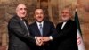 Turkish Foreign Minister Mevlut Cavusoglu, center, poses with his counterparts Elmar Mammadyarov, left, of Azerbaijan and Javad Zarif of Iran following a news conference in Istanbul, Turkey, Oct. 30, 2018.