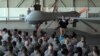 FILE - U.S. Defense Secretary Ash Carter addresses the U.S. troops as he stands in front of a drone at the Incirlik Air Base near Adana, Turkey, Dec. 15, 2015. 