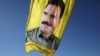 FILE - A banner with a picture of imprisoned Kurdish rebel leader Abdullah Ocalan is seen during a protest in Qamishli, Syria, Jan. 30, 2018.