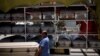 Vendors carry a coffin to deliver it to a funeral home as the coronavirus outbreak continues, in Ciudad Juarez, Mexico, May 19, 2021. 