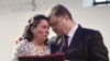 Ukrainian President Petro Poroshenko, right, presents a Hero of Ukraine award to a relative of an activist killed a year ago during mass protests, at the award ceremony in Kyiv, Feb. 20, 2015.