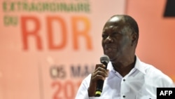 FILE - Ivorian President and leader of the liberal party RDR (Rassemblement des Republicains - Rally of the Republicans) Alassane Ouattara speaks during an extraordinary congress of the RDR on May 5, 2018 in Abidjan. 