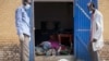 Staff open the doors of the morgue at the teaching hospital to add another body to the 24 already there, 20 of whom were killed from violence according to the staff, in Malakal, Upper Nile State, in South Sudan Tuesday, Jan. 21, 2014
