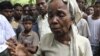 A Muslim woman weeps as she and others arrive at Thechaung camp refugee camp in Sittwe, Rakhine State, western Burma, Oct. 28, 2012.