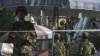 警方2011年8月1日加强在乌鲁木齐的警戒，中国指责穆斯林极端分子在咯什进行恐怖袭击
