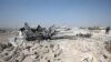 A destroyed vehicle at the site where helicopter gunfire reportedly killed nine people near the northwestern Syrian village of Barisha in the Idlib province, Oct. 27, 2019.