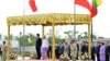 Japanese Prime Minister Shinzo Abe and Burma's President Thein Sein, take a salute of the honor guard at Presidential Palace, in Naypyitaw, Burma, May 26, 2013. 