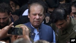 FILE - Former Pakistani prime pinister Nawaz Sharif leaves after appearing in court in Lahore, Pakistan, Oct. 8, 2018.