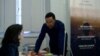 Imam Fouad Saanadi talks to a member of CAPRI's team. 