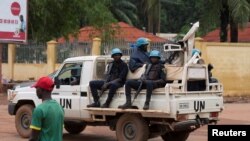 FILE - United Nations peacekeepers ride a pickup truck while on patrol in Bangui, Central African Republic, April 24, 2017. 
