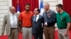 From left to right, British businessman Chris Norman, California student Anthony Sadler, French President Francois Hollande, U.S. Airman Spencer Stone, and Alek Skarlatos a U.S. National Guardsman pose at the Elysee Palace, Aug. 24, 2015 in Paris, France.