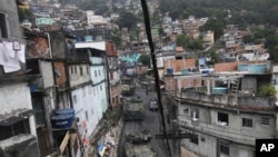 Brazilian navy armored vehicles move into Rocinha shantytown in Rio de Janeiro, Brazil, Nov. 13, 2011.