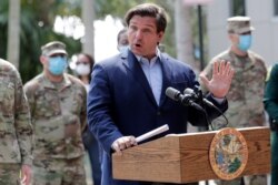 Florida Gov. Ron DeSantis responds to a question during a news conference at the Urban League of Broward County, April 17, 2020, in Fort Lauderdale, Fla.