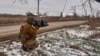 FILE - In this photo provided by the Ukrainian 10th Mountain Assault Brigade "Edelweiss," a Ukrainian soldier holds an anti-drone gun on his position near Bakhmut, Donetsk region, Ukraine, Nov. 23, 2023. Ukraine's military reported shooting down five Russian drones Dec. 18, 2023.