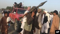 Taliban fighters gather in Surkhroad district of Nangarhar province, east of Kabul, Afghanistan, June 16, 2018.