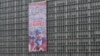 A government building in Caracas displays a poster with an image of the late Venezuelan President Hugo Chavez, Apr. 11, 2013. 