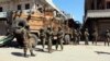 Turkish soldiers, positioned in the city center of Afrin, northwestern Syria, March 19, 2018, a day after they took the control of the area. Turkey's President Recep Tayyip Erdogan said following the victory in Syria's Afrin region, his country will expan