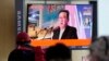 FILE - People watch a TV screen showing an image of North Korean leader Kim Jong Un during a news program at the Seoul Railway Station in Seoul, South Korea, Oct. 12, 2021. 