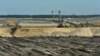 The Welzow-Sued open-pit coal mine, 70 miles south of Berlin, is one of several in eastern Germany’s Lusatia region. It is expected to expand in the coming years and consume the village of Proschim, just over a mile away.