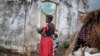 A woman holds her child at a makeshift camp for internally displaced persons (IDPs) among old abandoned buildings in Kalemie, Tanganyika province, Democratic Republic of the Congo, Sept. 18, 2017.