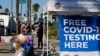 People wait in line to be tested for COVID-19 at a testing site in the North Hollywood section of Los Angeles on Saturday, Dec. 5, 2020. With coronavirus cases surging at a record pace, California Gov. Gavin Newsom announced a new stay-at-home order…
