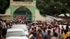 FILE - Muslims faithfuls carry a coffin with the body of Sheikh Mohammed Idris, chairman of the Council of Imams and Preachers of Kenya (CIPK), who was gunned down by assailants near his home in Mombasa, June 10, 2014.