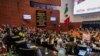 Protesters break into a Senate session in which lawmakers were debating the government's proposed judicial overhaul, which would make judges stand for election, in Mexico City, Sept. 10, 2024. The plan passed early Sept. 11 and now must be ratified by state legislatures.